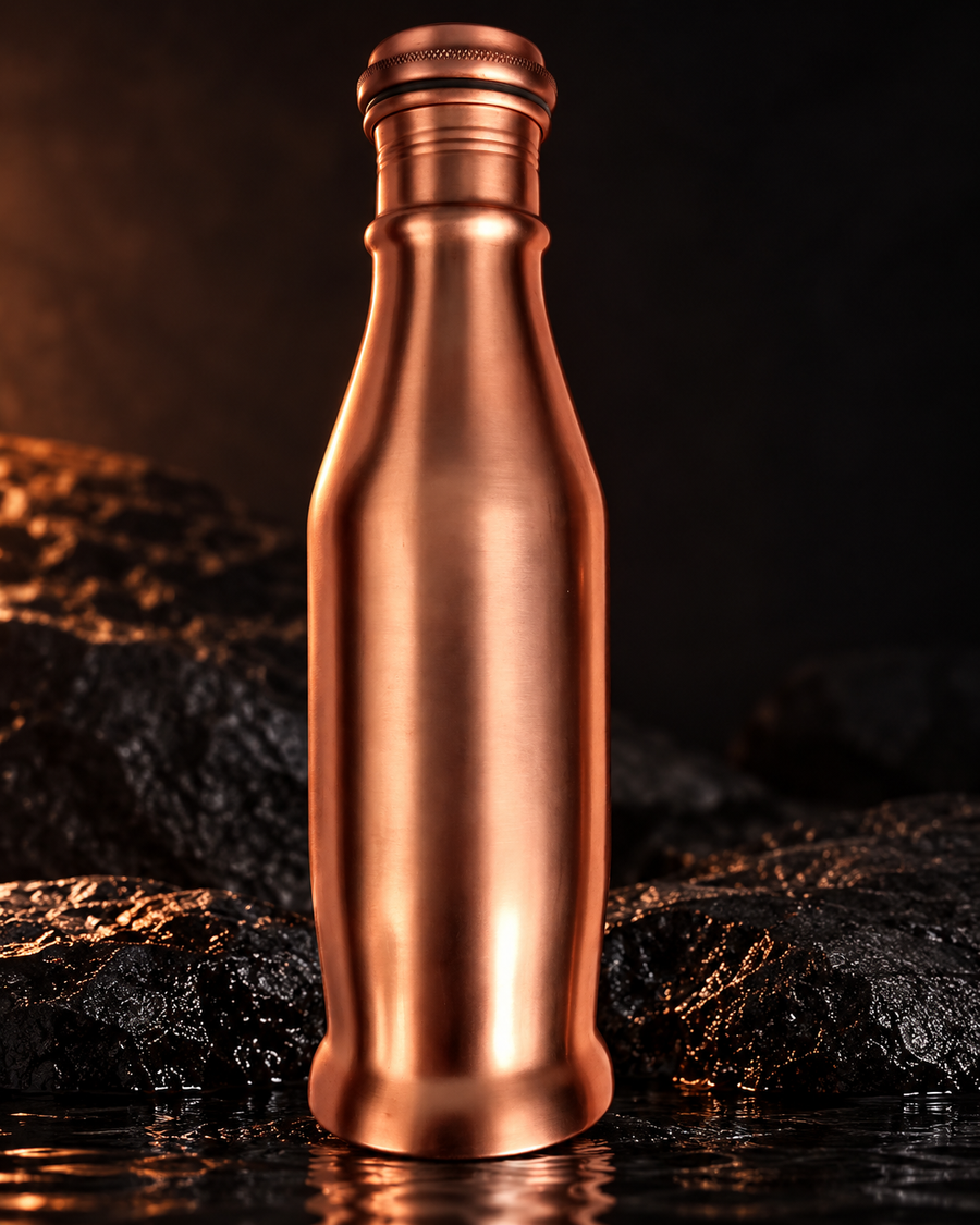 Pure copper bottle on dark stone